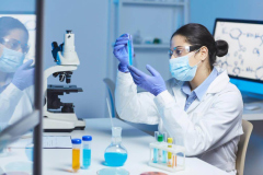 indian-chemist-examining-blue-liquid-1